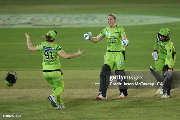 Heather Knight of the Thunder celebrates with Tammy Beaumont of the Thunder during the Women's Big Bash League Final between the Melbourne Stars and...