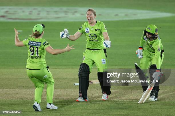 Heather Knight of the Thunder celebrates with Tammy Beaumont of the Thunder during the Women's Big Bash League Final between the Melbourne Stars and...