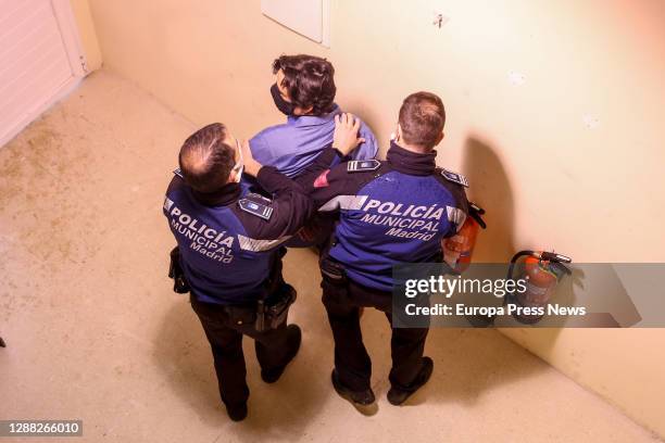 Two officers detain a man in the simulation of a case of gender violence during a training exercise given by the Municipal Police of Madrid...