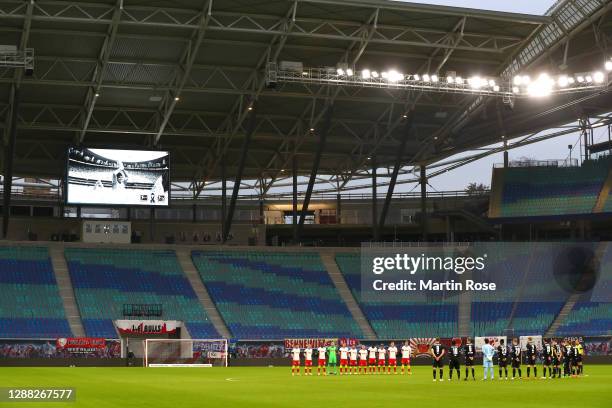 General view inside the stadium as RB Leipzig and DSC Arminia Bielefeld players observe a minutes silence for former footballer, Diego Maradona, who...