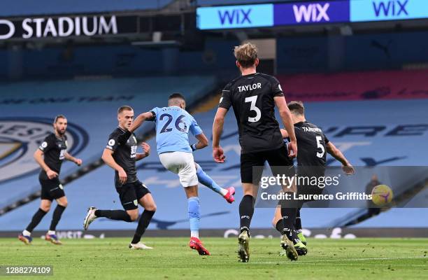 Riyad Mahrez of Manchester City scores his team's second goal during the Premier League match between Manchester City and Burnley at Etihad Stadium...