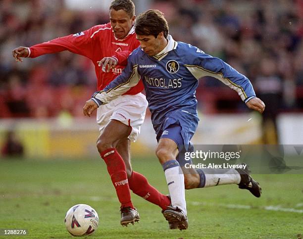 Gianfranco Zola of Chelsea is challenged by the Nottingham Forest defence during the FA Carling Premiership match in Nottingham, England. Chelsea won...