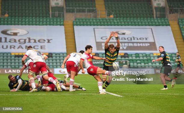 David Ribbans of Northampton Saints attempts to charge down a kick by Danny Care of Harlequins during the Gallagher Premiership Rugby match between...