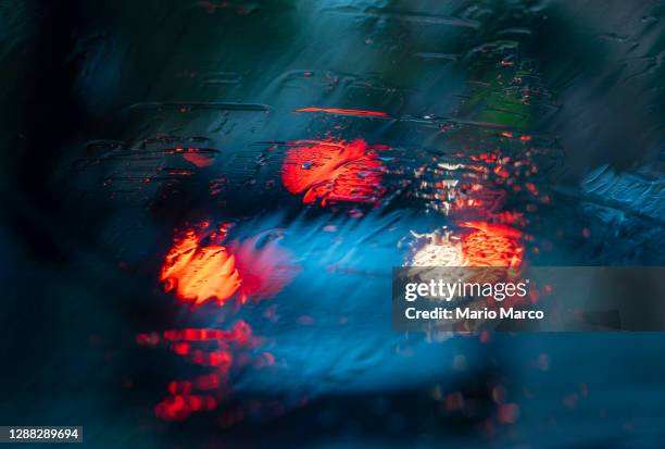 cars and rain - car crash scene stock-fotos und bilder