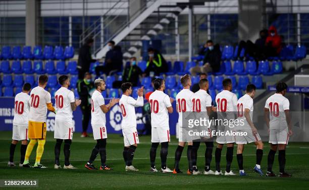 Sevilla players all wear shirts with the number ten in memory of Diego Maradona prior to the La Liga Santander match between SD Huesca and Sevilla FC...