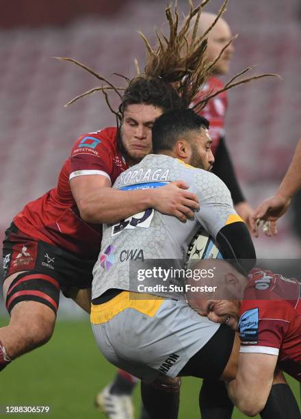 Wasps full back Lima Sopoaga is wrapped up by Gloucester players Matt Garvey and Jordy Reid during the Gallagher Premiership Rugby match between...