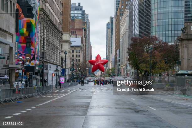 symbol of macy's believe star balloon appears on the 34th street and 6th avenue - virtual thanksgiving stock pictures, royalty-free photos & images