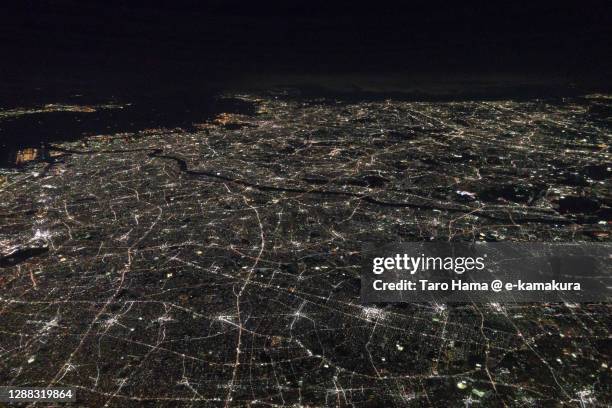 illuminated southern kanto plain of japan aerial view from airplane - tokai region stock-fotos und bilder