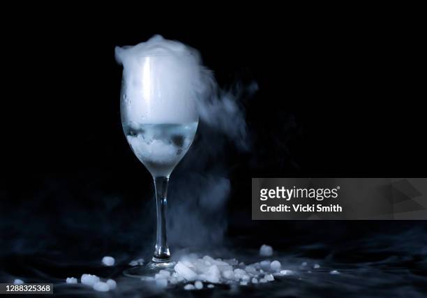use of creative effects with dry ice fog and a wine glass - dry ice stock pictures, royalty-free photos & images