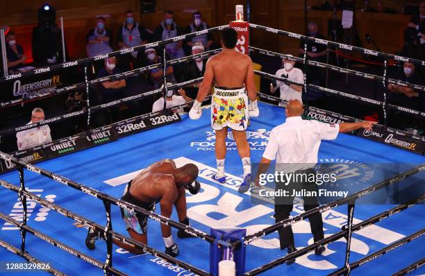 Daniel Dubois takes a knee as Joe Joyce walks to the corner during the WBC Silver heavyweight title, British, Commonwealth and European Heavyweight...