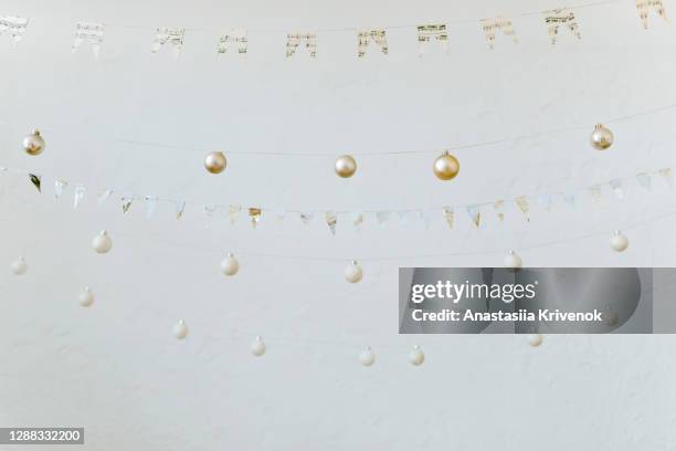 christmas handmad bunting flags and ornaments hanging on white background. - bunting white background fotografías e imágenes de stock