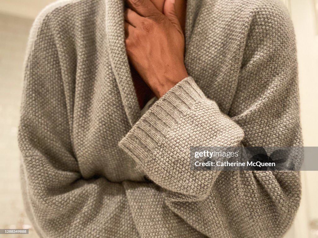 African-american woman experiences throat pain, chest pain & abdominal pain