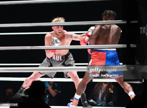 Jake Paul throws a punch against Nate Robinson in the first round during Mike Tyson vs Roy Jones Jr. Presented by Triller at Staples Center on...