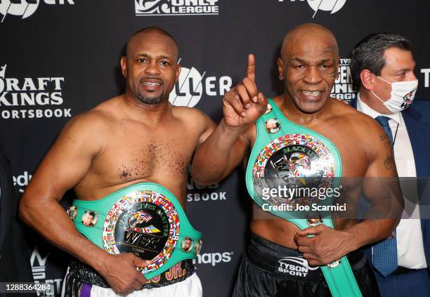 Roy Jones Jr. And Mike Tyson celebrate their split draw during Mike Tyson vs Roy Jones Jr. Presented by Triller at Staples Center on November 28,...