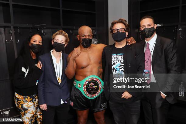 Kiki Tyson, Sophie Watts, Mike Tyson, John Ryan, and Azheem Spicer pose in the locker room during Mike Tyson vs Roy Jones Jr. Presented by Triller at...