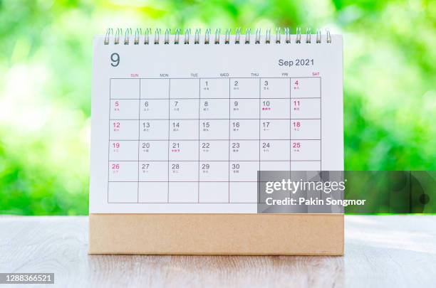 calendar desk 2021 september month for organizer to plan and reminder on wooden table on nature background. - week nine stock-fotos und bilder