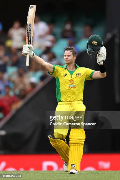 Steve Smith of Australia celebrates making 100 runs during game two of the One Day International series between Australia and India at Sydney Cricket...