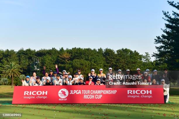 Winner Erika Hara and players pose for photographs after the final round of the JLPGA Tour Championship Ricoh Cup at the Miyazaki Country Club on...