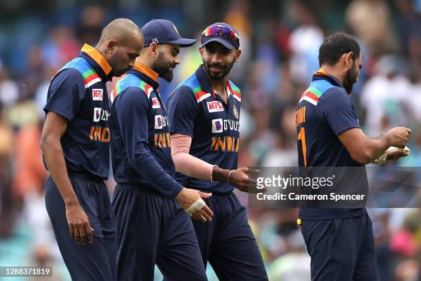 Virat Kohli and his Indian team mates walk off the field during game two of the One Day International series between Australia and India at Sydney...