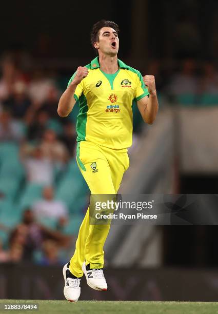 Pat Cummins of Australia celebrates after taking the wicket of Mayank Agarwal of India during game two of the One Day International series between...