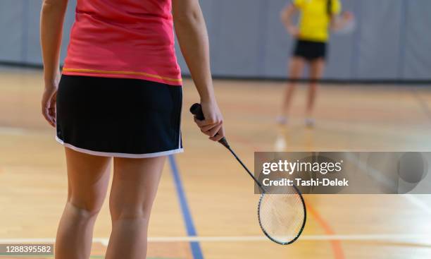 woman playing badminton - women's badminton stock pictures, royalty-free photos & images