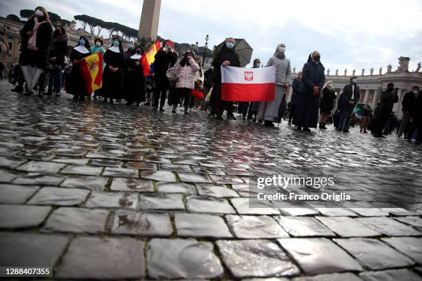 Nuns and faithful attend Pope Francis' Sunday Angelus Blessing at St. Peter's Square on November 29, 2020 in Vatican City, Vatican. Following Mass...