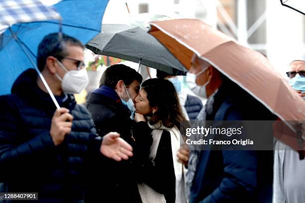 Couple kiss as faithful attend Pope Francis' Sunday Angelus Blessing at St. Peter's Square on November 29, 2020 in Vatican City, Vatican. Following...