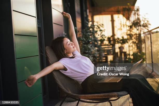 young woman taking a break from work - after work stock pictures, royalty-free photos & images