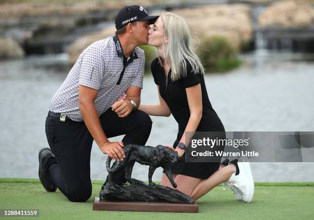 Christiaan Bezuidenhout of South Africa is congratulated by his fiancée Kristen Hart after winning the Alfred Dunhill Championship at Leopard Creek...