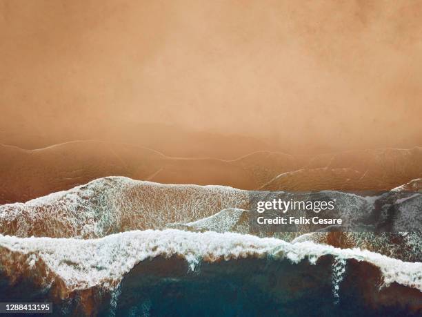 drone beach background photo. - gold meets golden fotografías e imágenes de stock