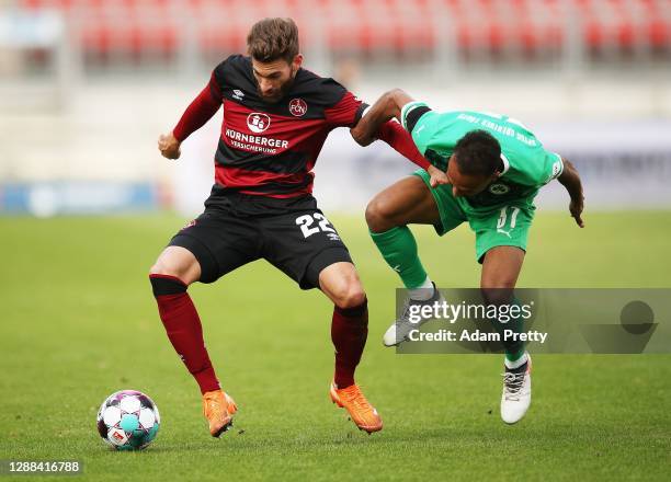 Enrico Valentini of 1. FC Nuernberg is challenged by Julian Green of SpVgg Greuther Fuerth during the Second Bundesliga match between 1. FC Nürnberg...