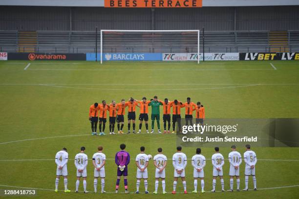 Players observe a minutes silence for former footballer, Diego Maradona, who recently passed away prior to the Emirates FA Cup Second Round match...