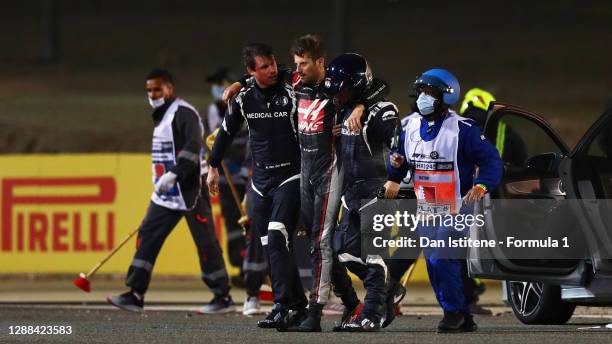 Romain Grosjean of France and Haas F1 is pictured walking from his car after a crash during the F1 Grand Prix of Bahrain at Bahrain International...