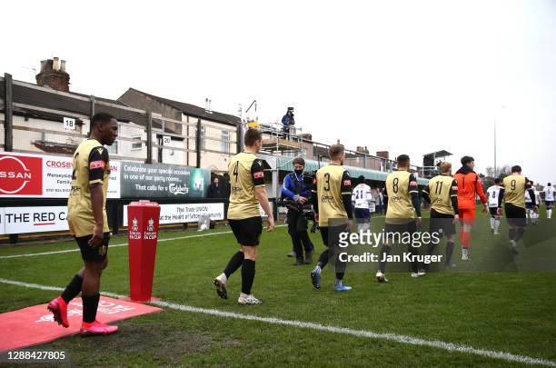 Havant and Waterlooville players enter the pitch ahead of the Emirates FA Cup Second Round match between Marine FC and Havant and Waterloovile at The...