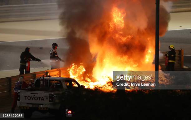 Fire is pictured following the crash of Romain Grosjean of France and Haas F1 during the F1 Grand Prix of Bahrain at Bahrain International Circuit on...