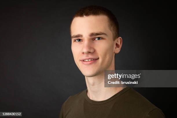 studio portrait of 18 year old man - khaki stock pictures, royalty-free photos & images