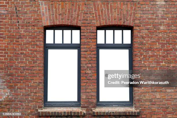 beautiful old rough brick wall and windows with black frame and isolated white empty space. - window frame ストックフォトと画像