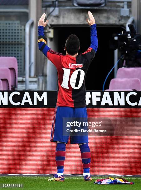 Lionel Messi of Barcelona celebrates after scoring their sides fourth goal while wearing a Newell's Old Boys shirt with the number 10 on the back in...