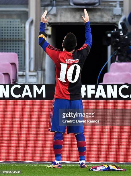 Lionel Messi of Barcelona celebrates after scoring their sides fourth goal while wearing a Newell's Old Boys shirt with the number 10 on the back in...