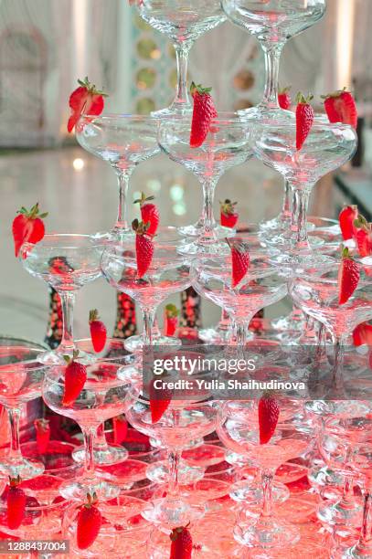 champagne pyramid tower with strawberries - crystal glassware stock pictures, royalty-free photos & images