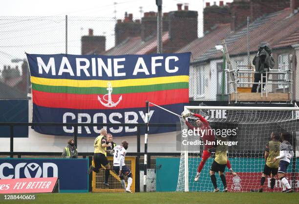 General view of play as Ross Worner of Havant and Waterlooville catches the ball during the Emirates FA Cup Second Round match between Marine FC and...