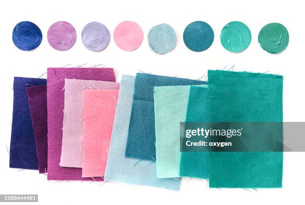 fabric textile color swatch palette guide. purple blue green on white background - stoffmuster stock-fotos und bilder