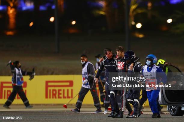 Romain Grosjean of France and Haas F1 is pictured walking from his car after a crash during the F1 Grand Prix of Bahrain at Bahrain International...