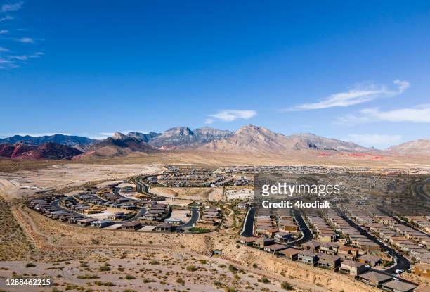 urban housing development on desert landscaoe - nevada stock pictures, royalty-free photos & images