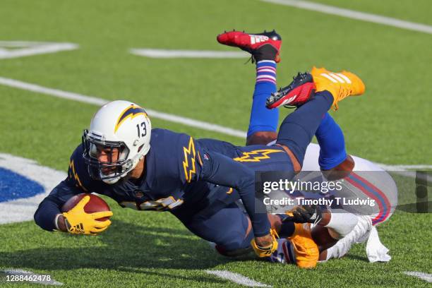 Tre'Davious White of the Buffalo Bills tackles Keenan Allen of the Los Angeles Chargers during the first quarter at Bills Stadium on November 29,...