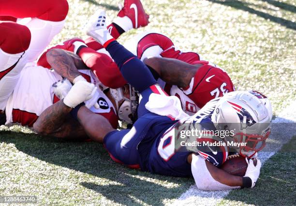 James White of the New England Patriots scores a 7 yard touchdown run against Budda Baker of the Arizona Cardinals during the second quarter of the...