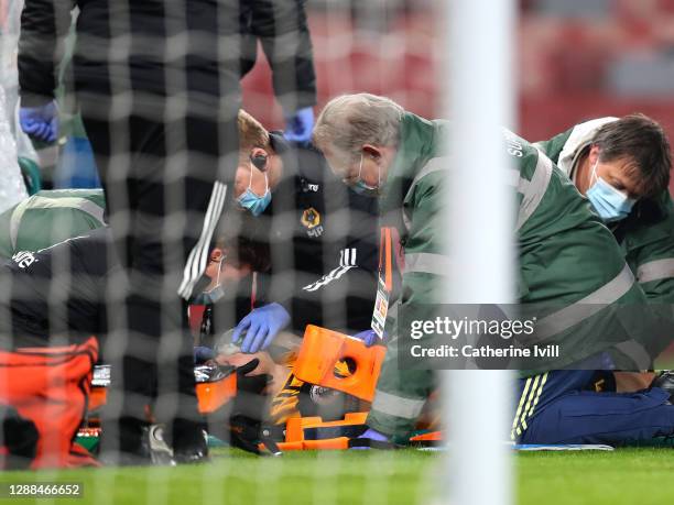 Raul Jimenez of Wolverhampton Wanderers receives medical treatment during the Premier League match between Arsenal and Wolverhampton Wanderers at...