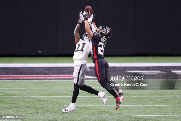 Terrell of the Atlanta Falcons breaks up a pass intended for Henry Ruggs III of the Las Vegas Raiders during their NFL game at Mercedes-Benz Stadium...