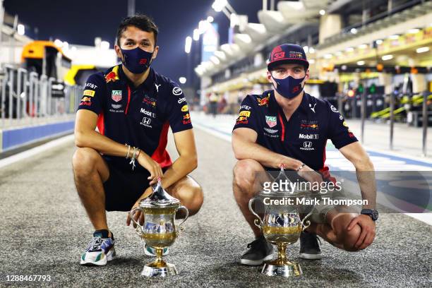 Second placed Max Verstappen of Netherlands and Red Bull Racing and third placed Alexander Albon of Thailand and Red Bull Racing celebrate with their...
