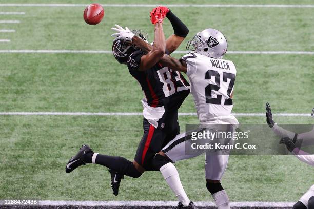 Trayvon Mullen of the Las Vegas Raiders breaks up a pass in the end zone intended for Russell Gage of the Atlanta Falcons during their NFL game at...